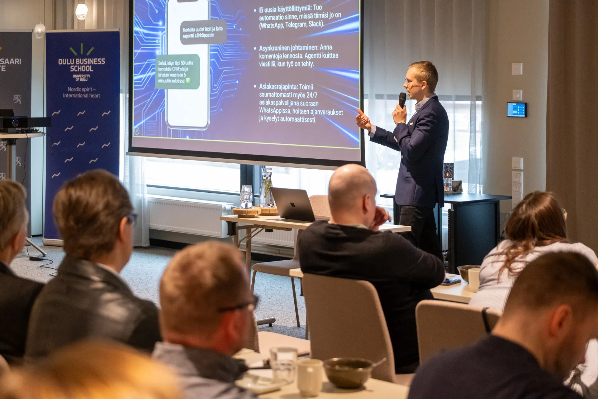 Valtteri Kujala running an AI workshop, presenting an AI agent workflow